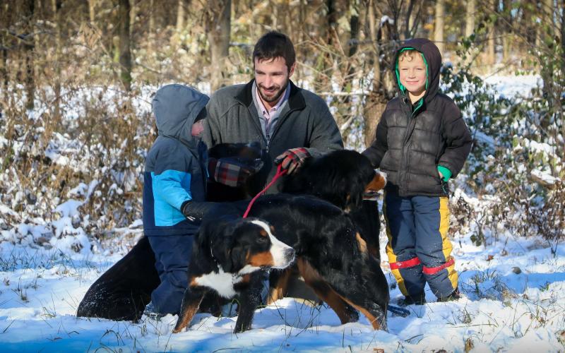 Javin and the boys spending time with the dogs in the snow! Javin and the boys