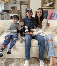 Family with mini bernedoodle